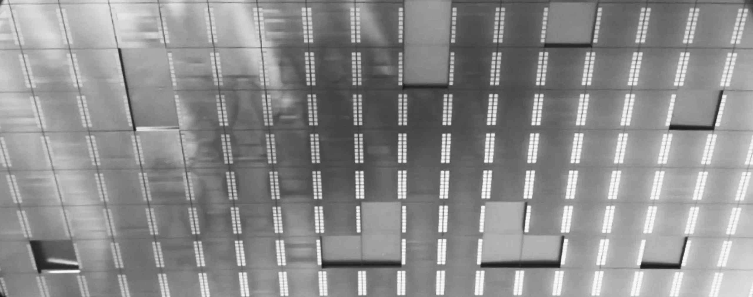 Close-up of a semiconductor wafer with a grid pattern, representing SkyWater Technology's focus on quantum computing solutions.