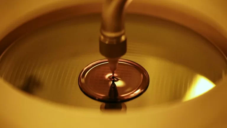 Silicon wafer undergoing processing in a semiconductor fabrication facility, highlighting advanced manufacturing techniques.